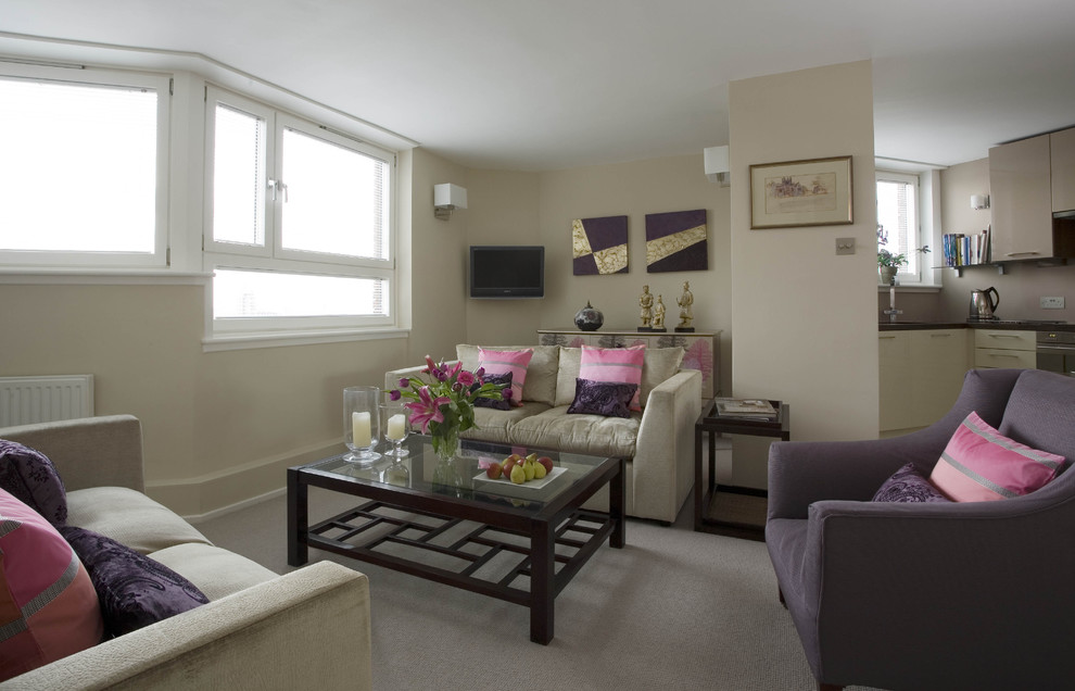 Example of a mid-sized eclectic living room design in London with beige walls