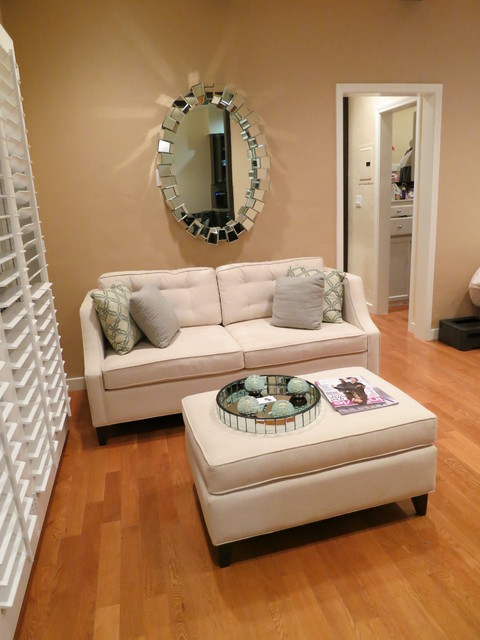 Small Classic Loveseat Under Oval Mirror The Sofa Company