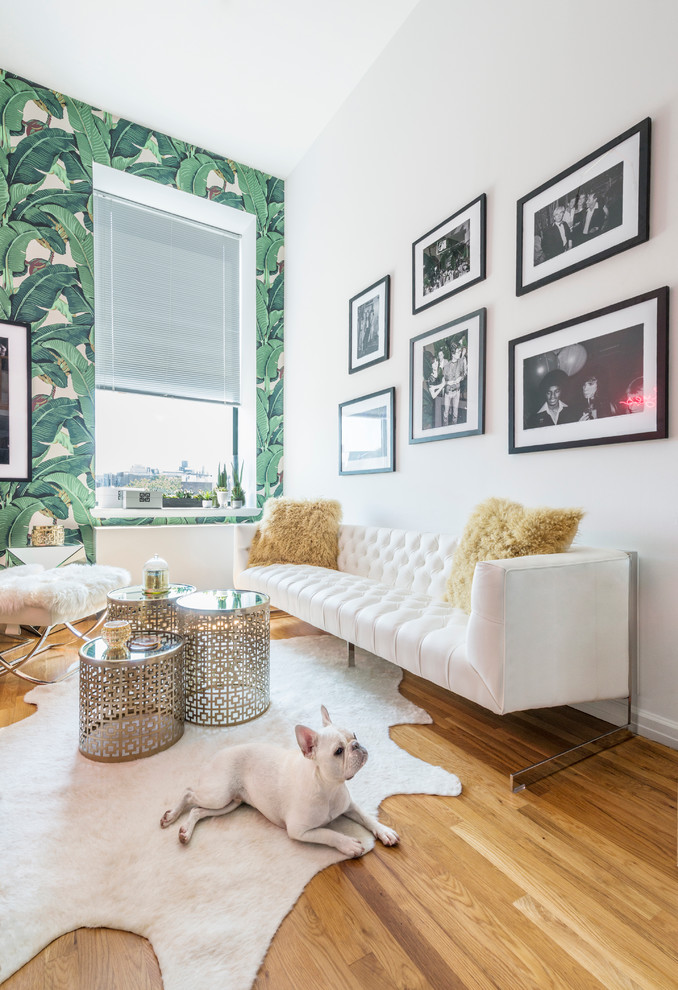 Inspiration for a transitional medium tone wood floor living room remodel in Los Angeles with green walls