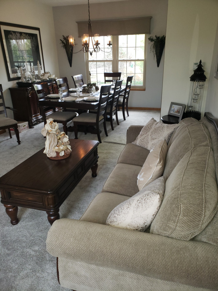 Example of a large classic formal and enclosed carpeted and gray floor living room design in Indianapolis with gray walls, a standard fireplace, a wood fireplace surround and no tv