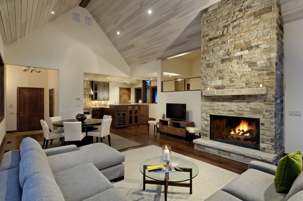 Mountain style living room photo in Other with white walls