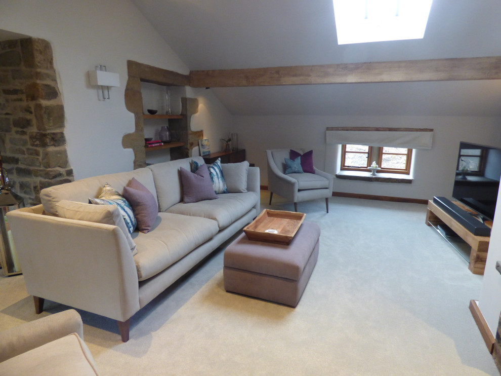 Photo of a large contemporary formal and grey and teal open plan living room in Kent with purple walls, carpet, a wood burning stove, a brick fireplace surround, a corner tv, beige floors and exposed beams.