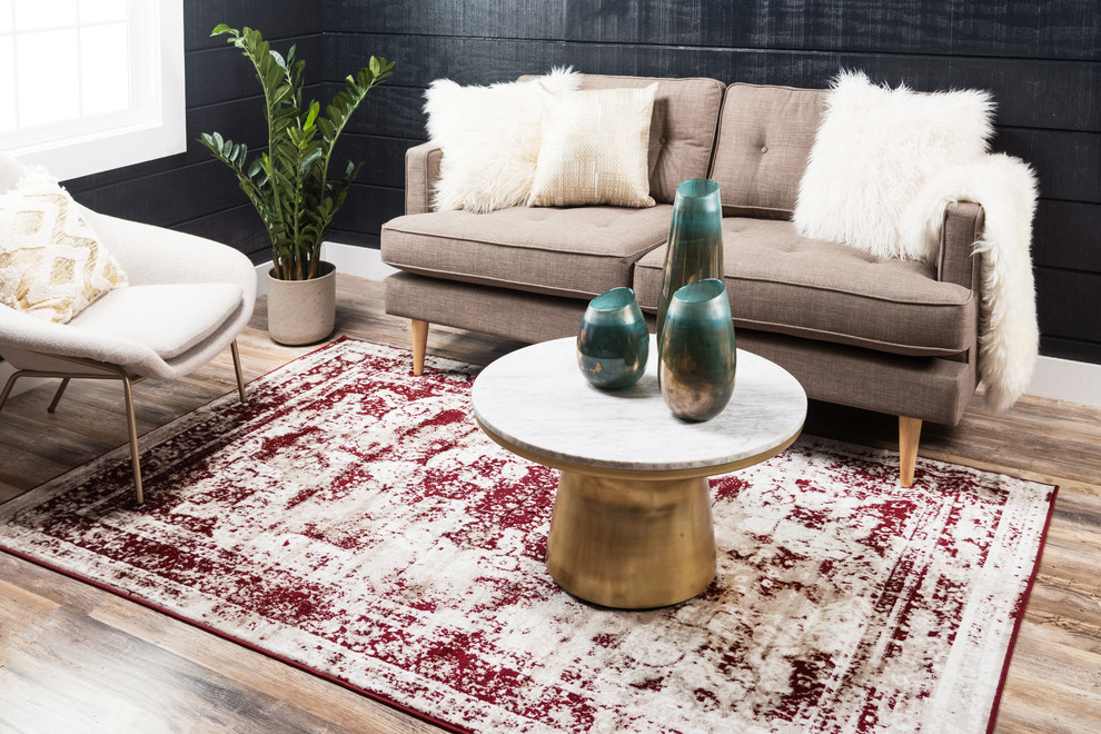 Immagine di un soggiorno minimalista con pareti nere e pavimento in legno massello medio