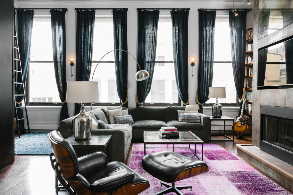 Inspiration for a large contemporary grey and purple open plan living room in New York with dark hardwood flooring, a standard fireplace, a built-in media unit, a music area, white walls and a metal fireplace surround.