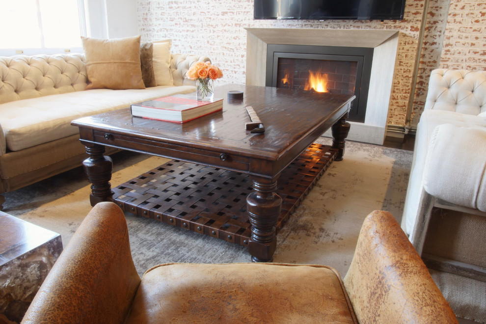 Example of a mid-sized urban loft-style dark wood floor living room design in New York with a ribbon fireplace and a stone fireplace