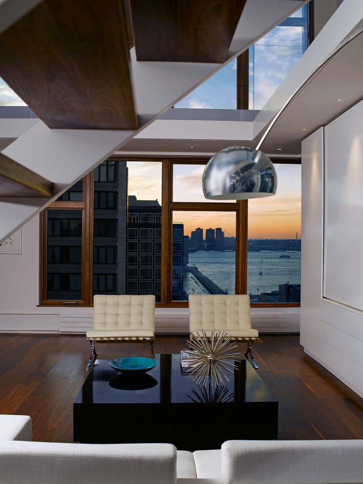 Design ideas for a modern living room in New York with a reading nook and feature lighting.