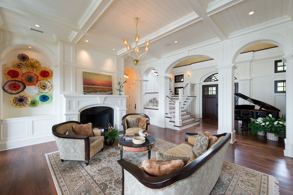 Photo of a traditional living room in Charleston with a music area and white walls.