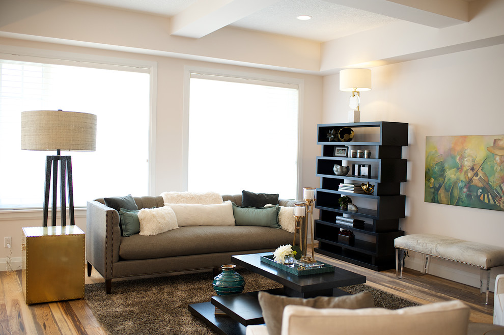 Photo of a medium sized contemporary open plan living room in Edmonton with pink walls, medium hardwood flooring, no fireplace and no tv.