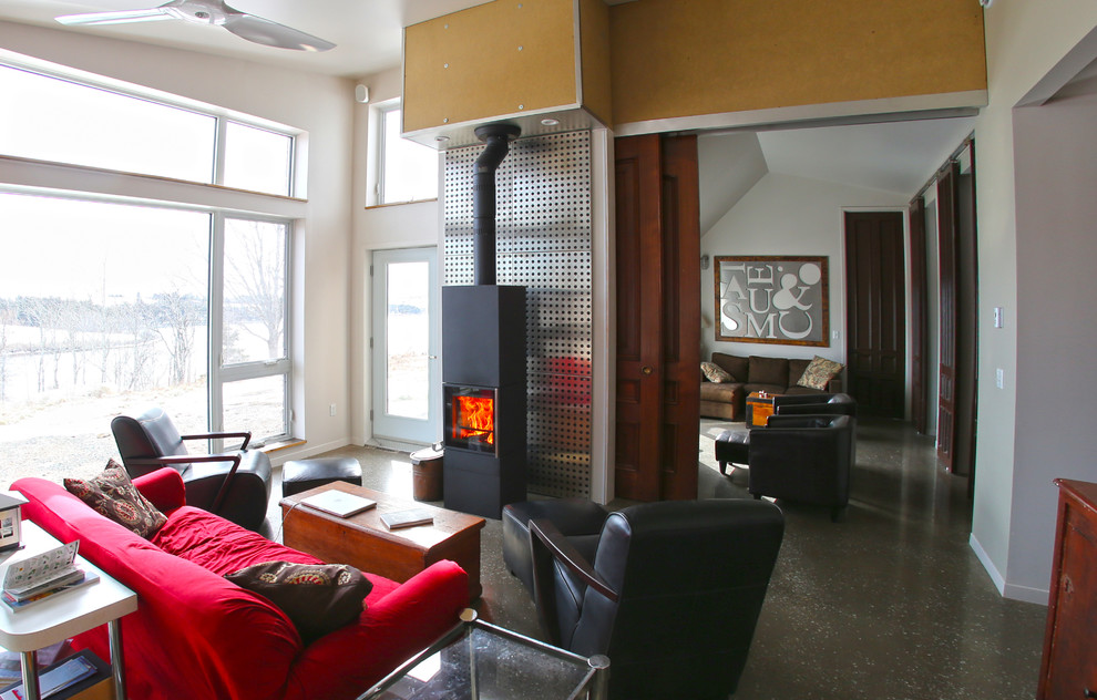Example of a trendy living room design in Other with a wood stove