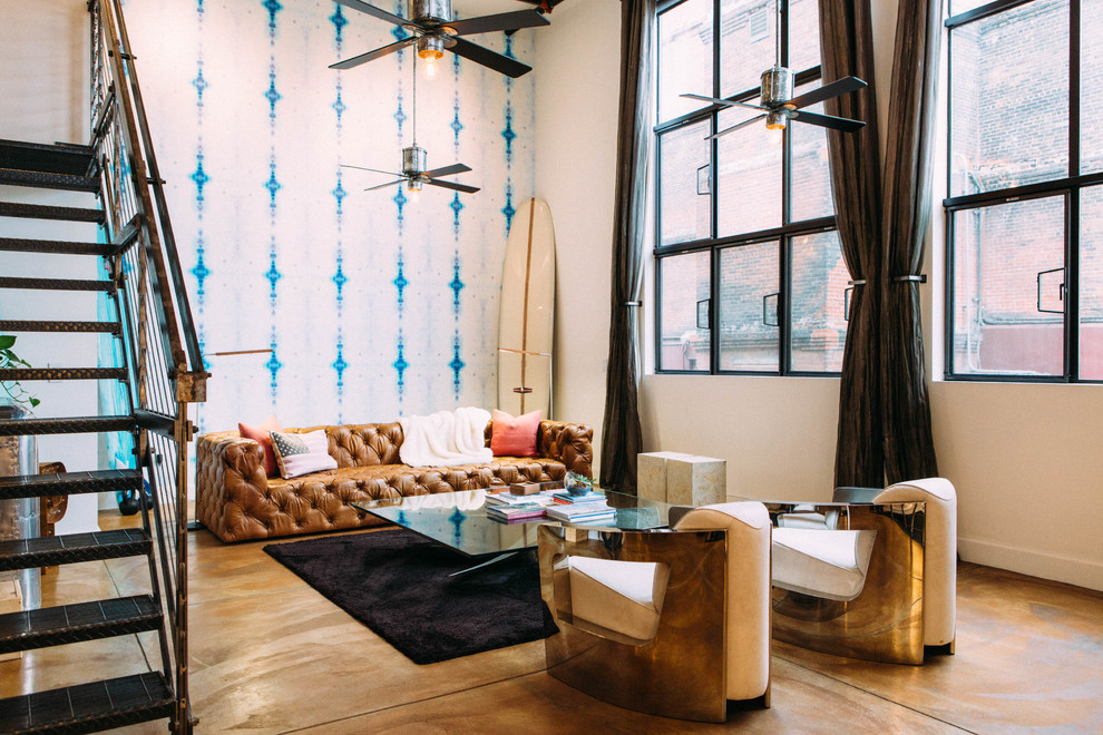 Living room - large industrial open concept concrete floor living room idea in Los Angeles with multicolored walls, no fireplace and no tv