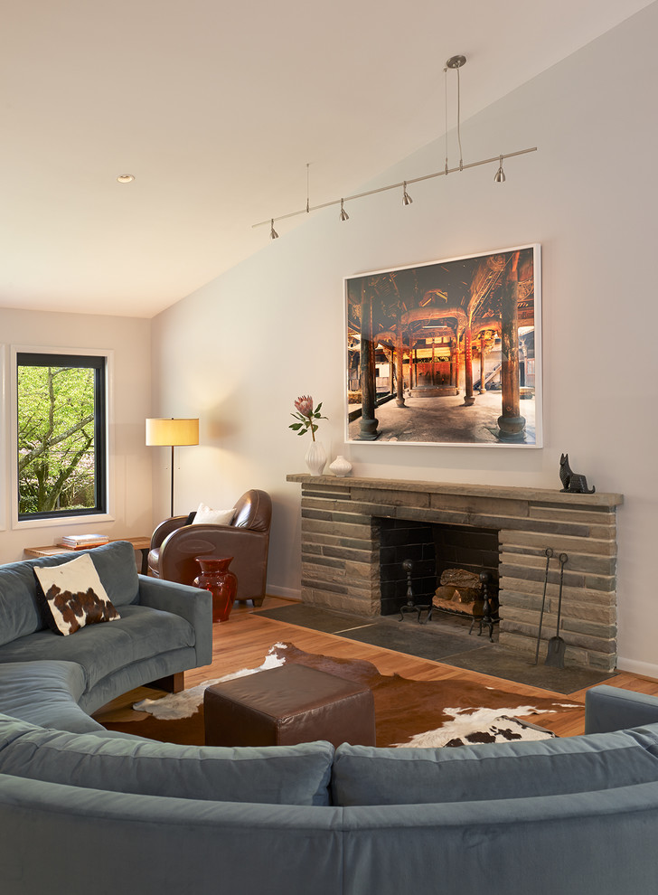 Inspiration for a medium sized midcentury formal open plan living room in DC Metro with grey walls, medium hardwood flooring, a standard fireplace and a stone fireplace surround.