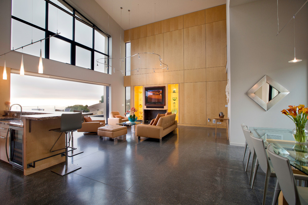 Exemple d'un salon moderne avec sol en béton ciré.