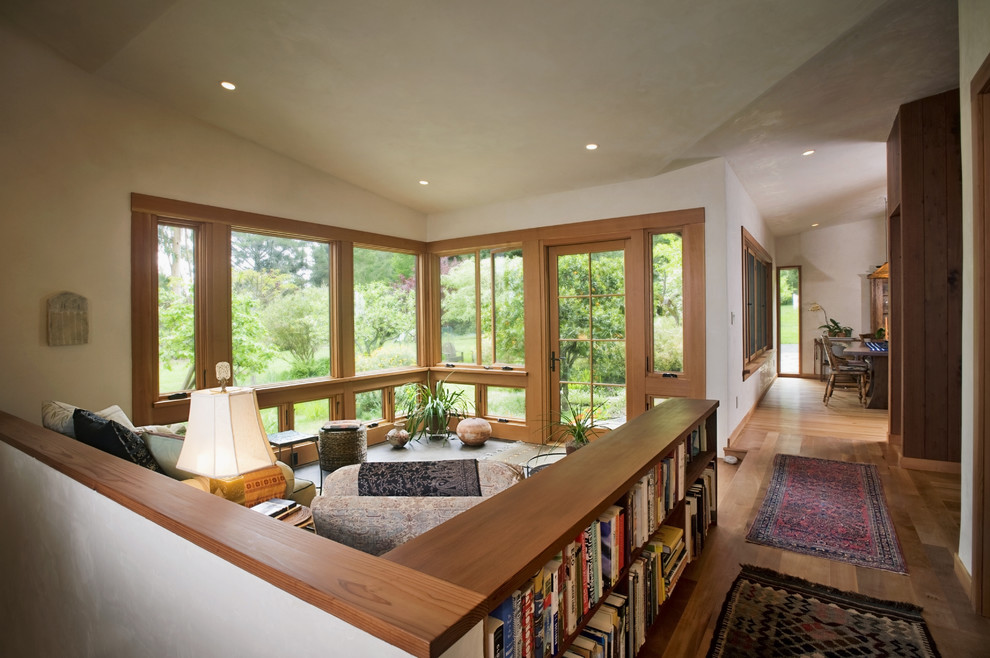 Example of a minimalist open concept medium tone wood floor living room design in San Francisco