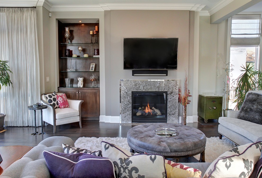 Inspiration for a mid-sized modern open concept dark wood floor living room remodel in Cleveland with beige walls, a standard fireplace, a stone fireplace and a wall-mounted tv