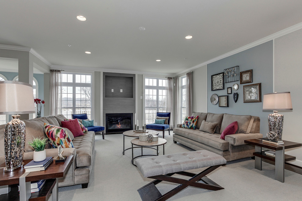 Photo of a large traditional open plan living room in DC Metro with grey walls, dark hardwood flooring, a standard fireplace and a tiled fireplace surround.
