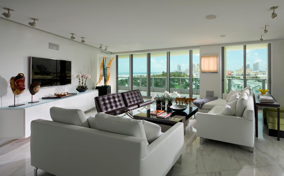 Example of a mid-sized minimalist loft-style marble floor living room design in Miami with white walls