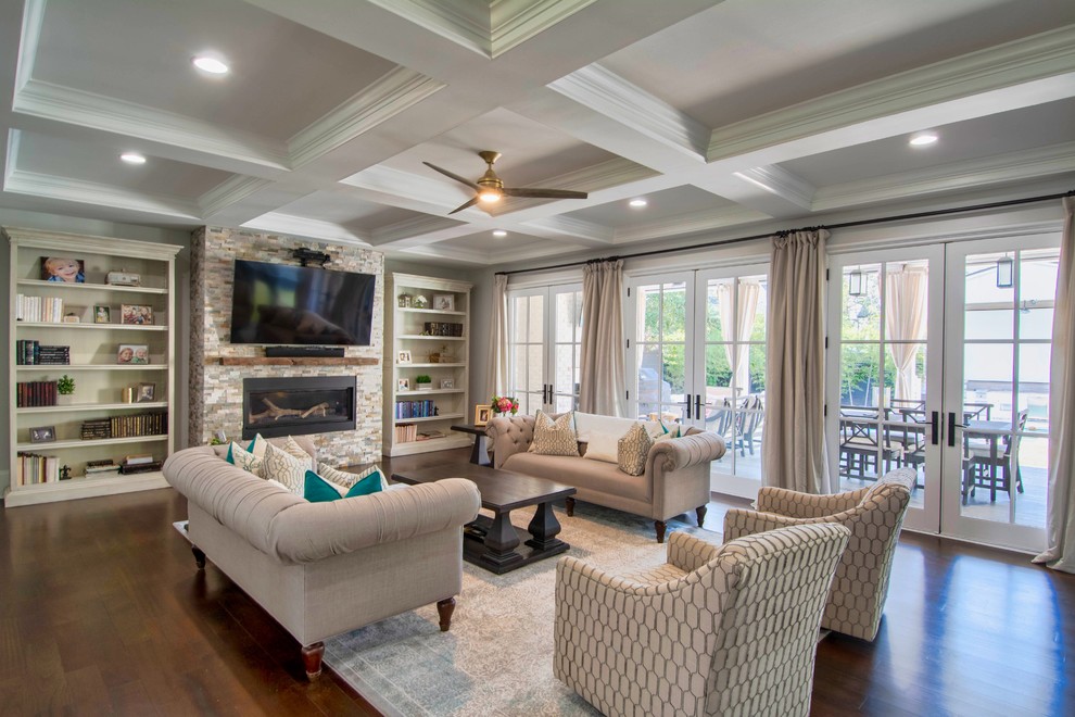 Inspiration for a transitional open concept medium tone wood floor and brown floor living room remodel in Charlotte with a ribbon fireplace, a stone fireplace and a wall-mounted tv