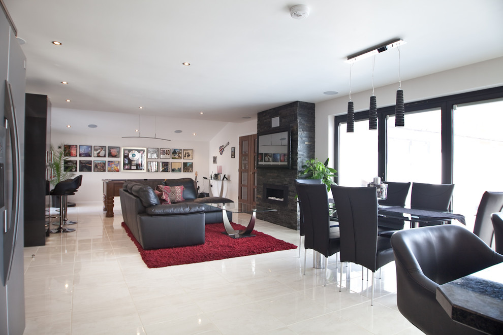 Inspiration for a large modern living room in Sussex with white walls and a wall mounted tv.