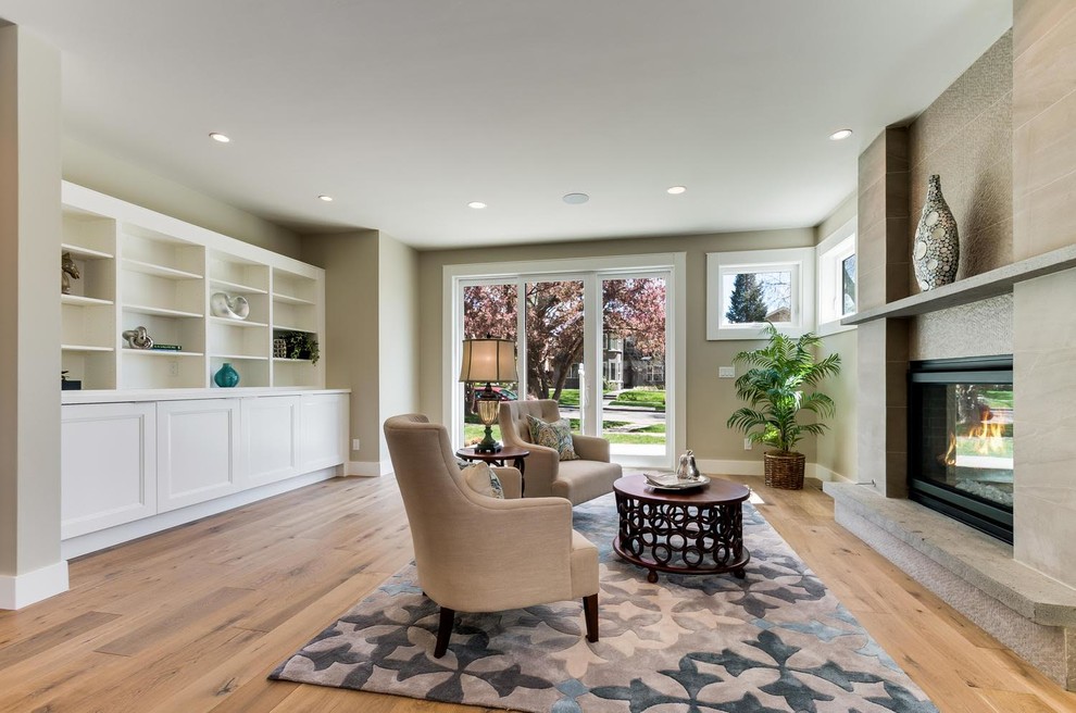 Medium sized classic open plan living room in Denver with beige walls, light hardwood flooring and beige floors.