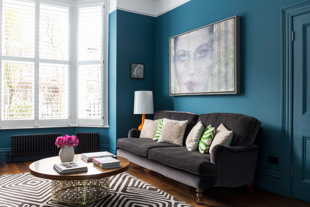 Inspiration for a contemporary grey and teal living room in London.