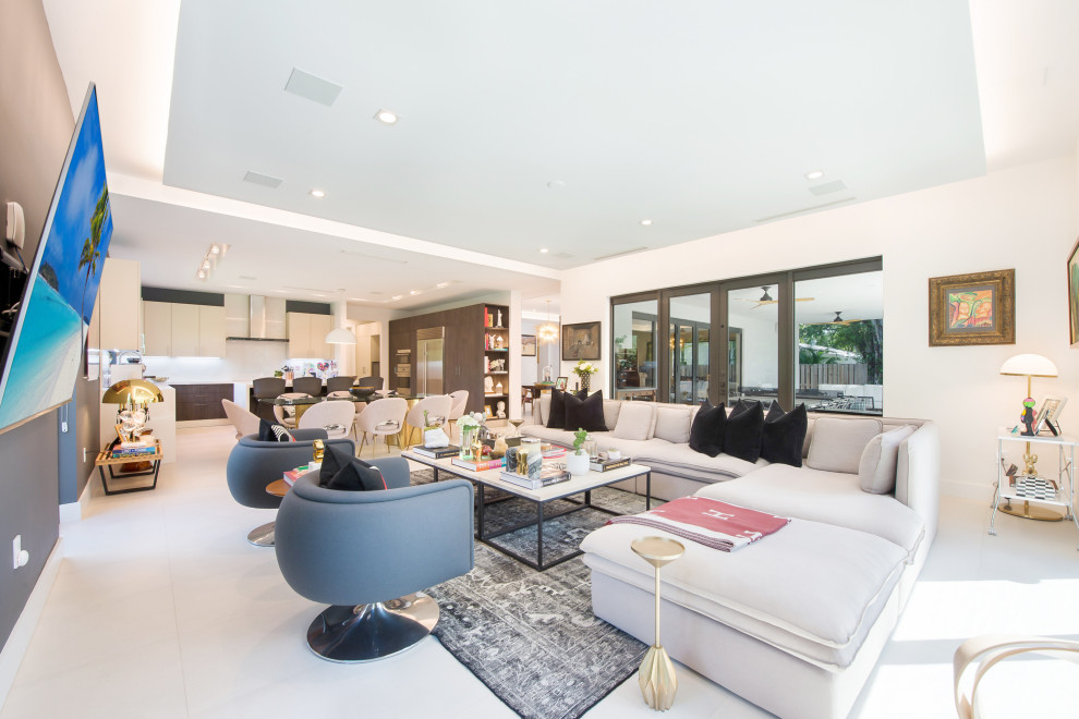 Inspiration for a contemporary open plan living room in Miami with white walls and white floors.