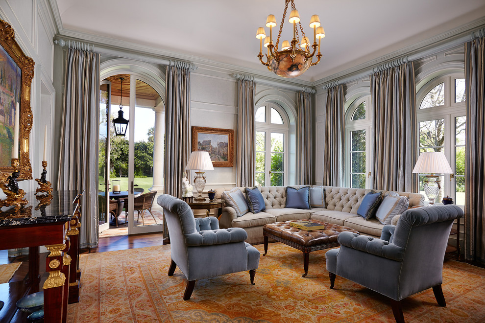 This is an example of a mediterranean living room in Other with dark hardwood flooring and brown floors.