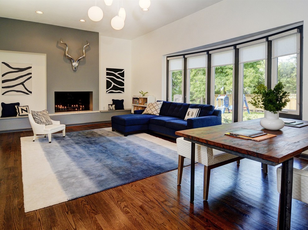 Trendy formal and open concept dark wood floor living room photo in Newark with multicolored walls and no tv