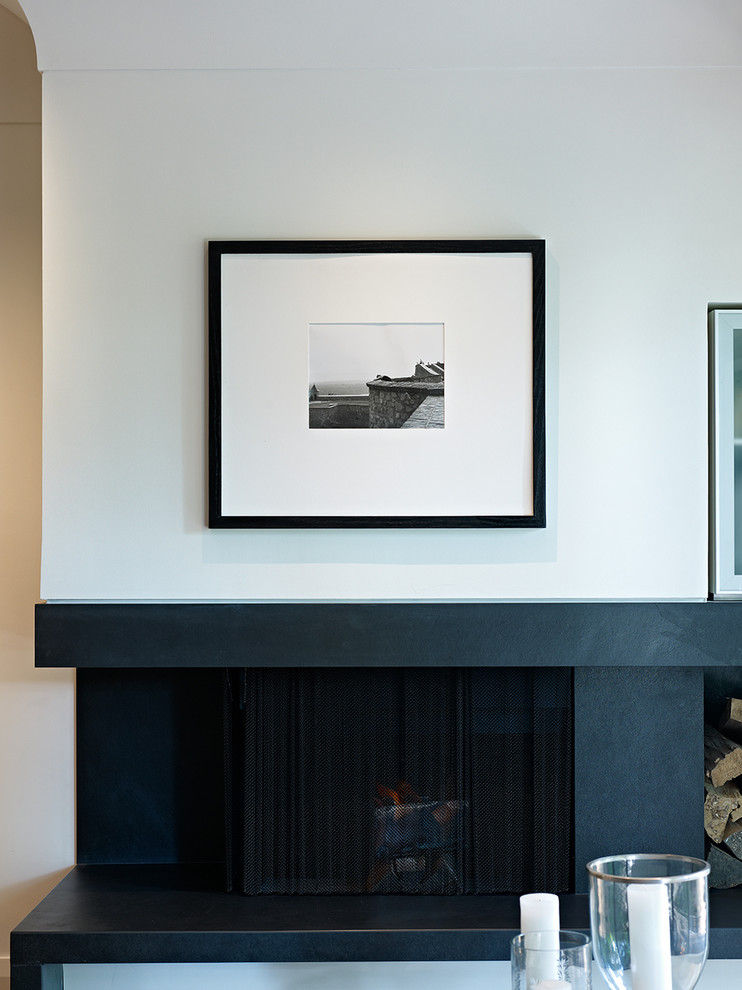 Example of a mid-sized trendy formal and open concept medium tone wood floor living room design in Toronto with white walls, a ribbon fireplace and a wood fireplace surround