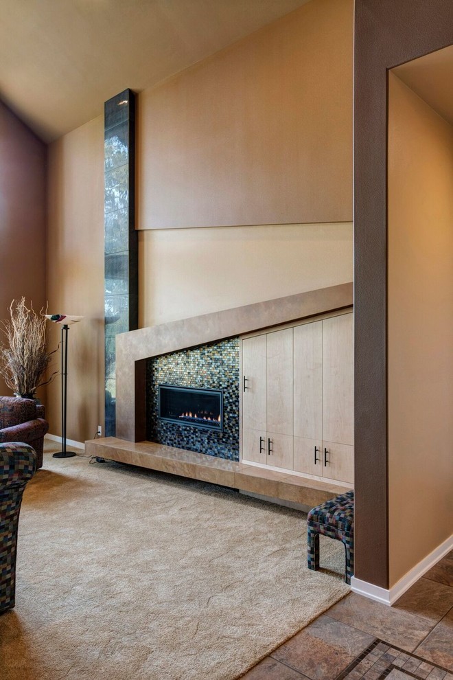 Mid-sized mid-century modern formal and open concept carpeted and beige floor living room photo in Portland with brown walls, a standard fireplace and no tv