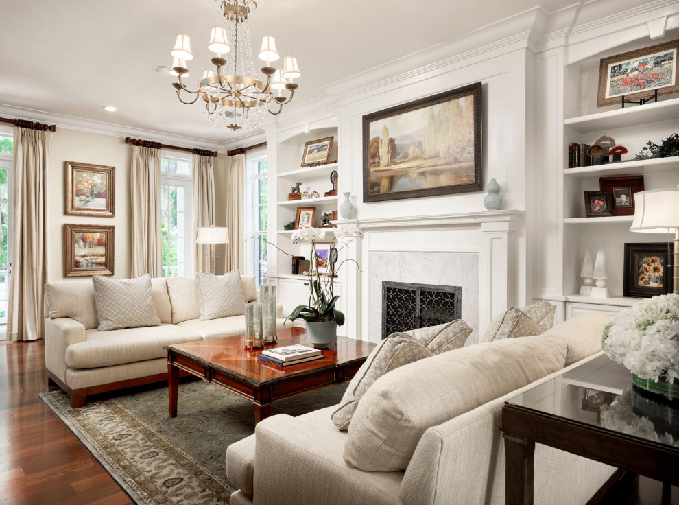 Design ideas for a traditional formal enclosed living room in Miami with beige walls, medium hardwood flooring, a standard fireplace, a stone fireplace surround, no tv and brown floors.