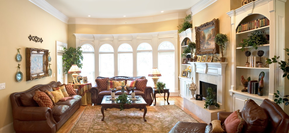 Inspiration for a medium sized classic formal enclosed living room in Atlanta with beige walls, a standard fireplace, a tiled fireplace surround, no tv and light hardwood flooring.