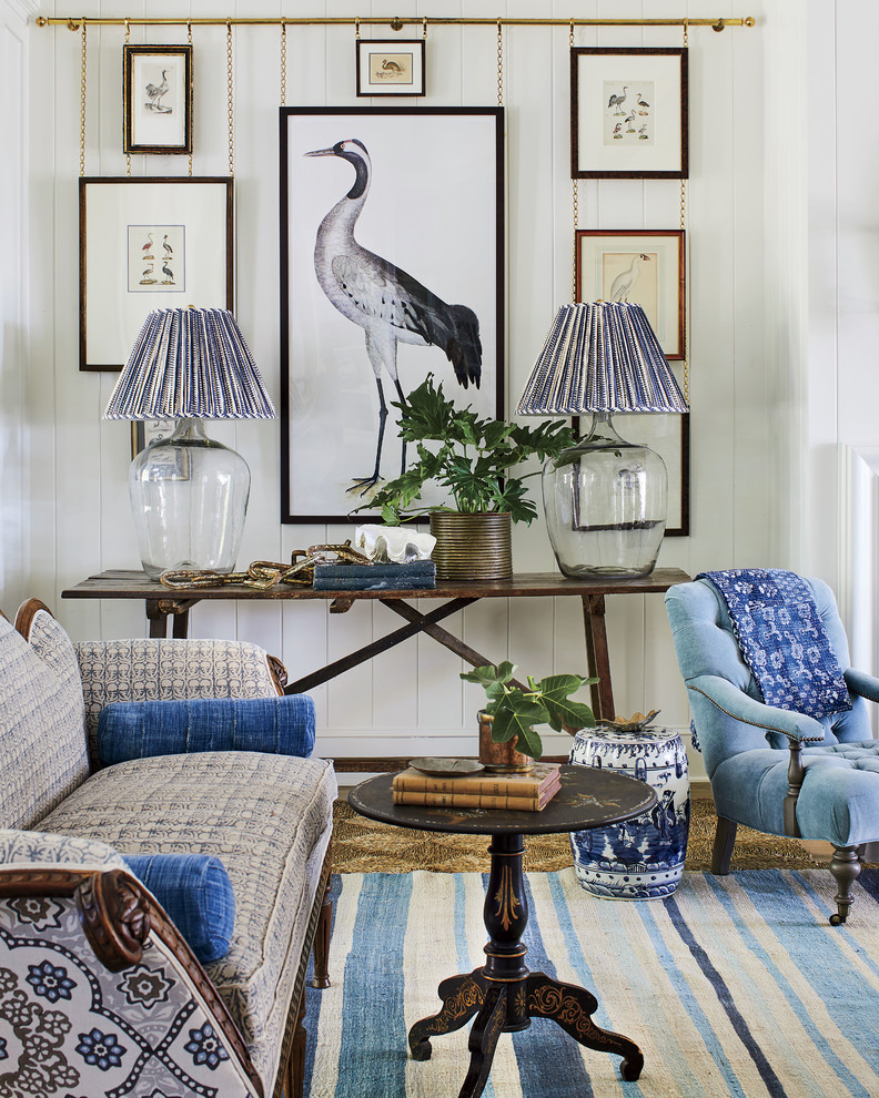 Inspiration for a coastal living room remodel in Jacksonville with white walls
