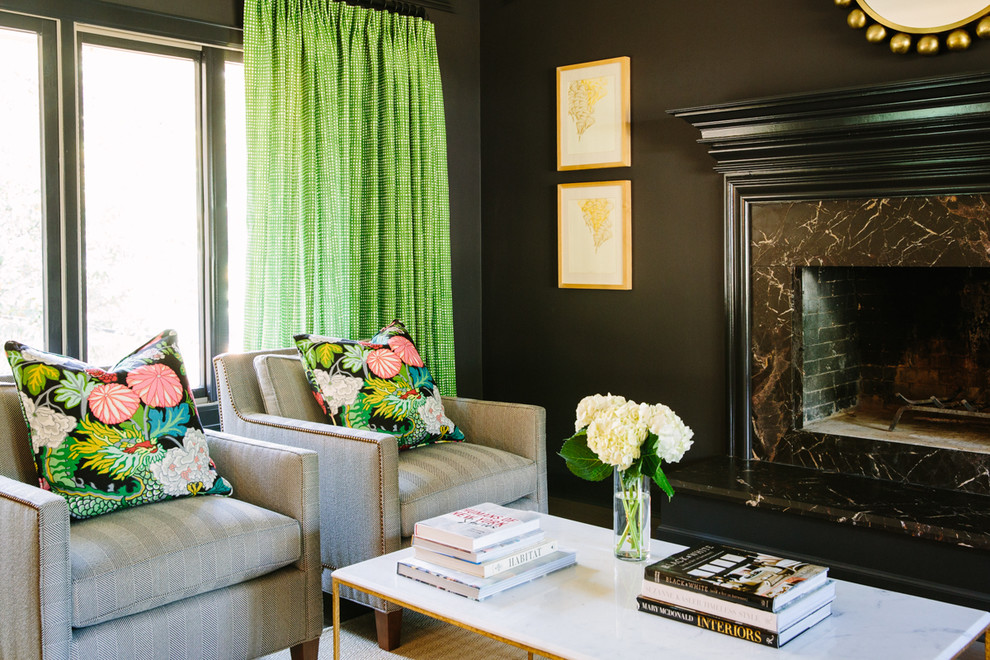 Example of a transitional living room design in Austin with black walls and a stone fireplace