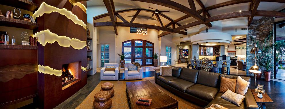 Inspiration for an expansive open plan living room in Phoenix with a home bar, white walls and dark hardwood flooring.