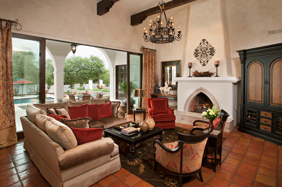 Mediterranean living room in Phoenix with terracotta flooring.