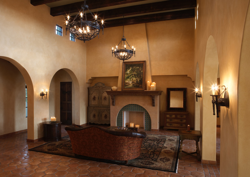Example of a large tuscan terra-cotta tile living room design in Austin