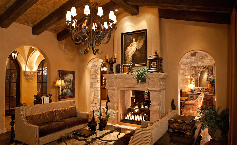 Inspiration pour un très grand salon chalet fermé avec une salle de réception, un mur beige, un sol en bois brun, une cheminée double-face et un manteau de cheminée en pierre.