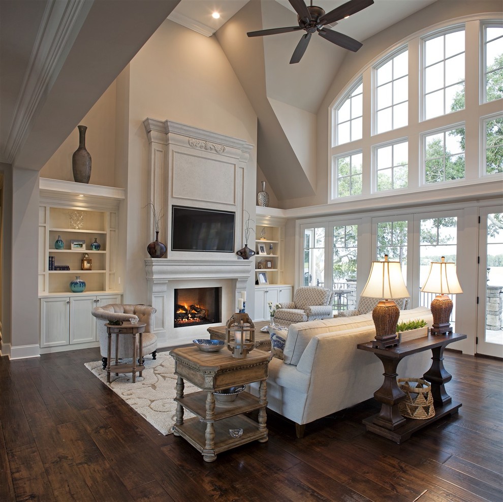 Inspiration for a small classic open plan living room in Atlanta with beige walls, dark hardwood flooring, a standard fireplace, a wooden fireplace surround and a built-in media unit.