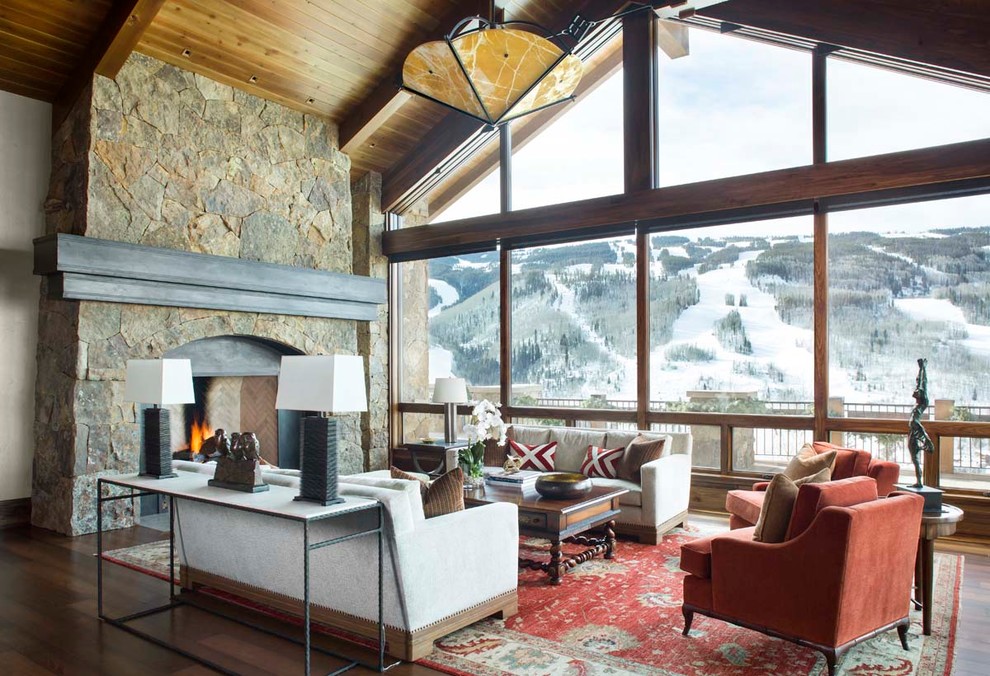 Rustic formal open plan living room in Denver with medium hardwood flooring and a standard fireplace.