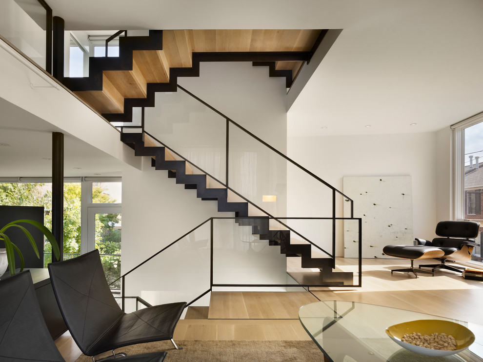 Example of a minimalist living room design in Philadelphia with white walls