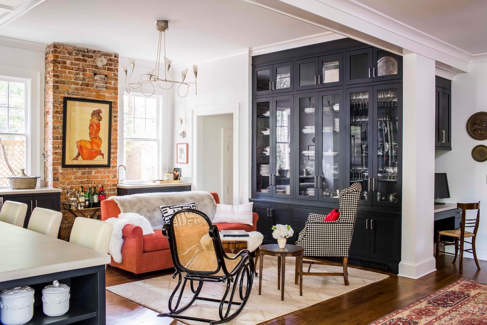 Inspiration for a transitional open concept dark wood floor living room remodel in Atlanta with white walls and no fireplace