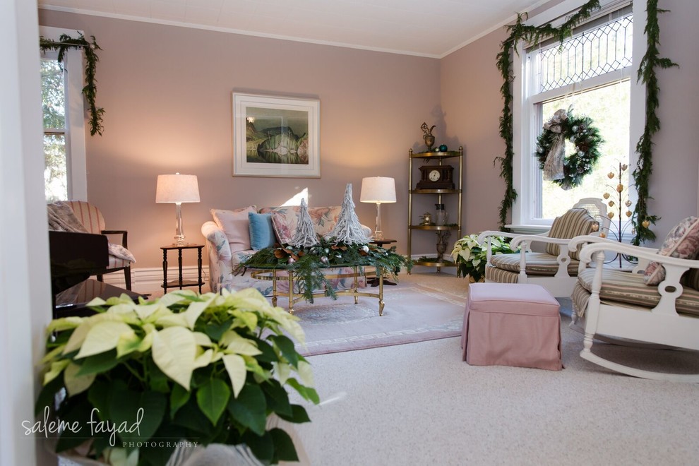 Example of a mid-sized farmhouse carpeted living room design in Toronto with pink walls