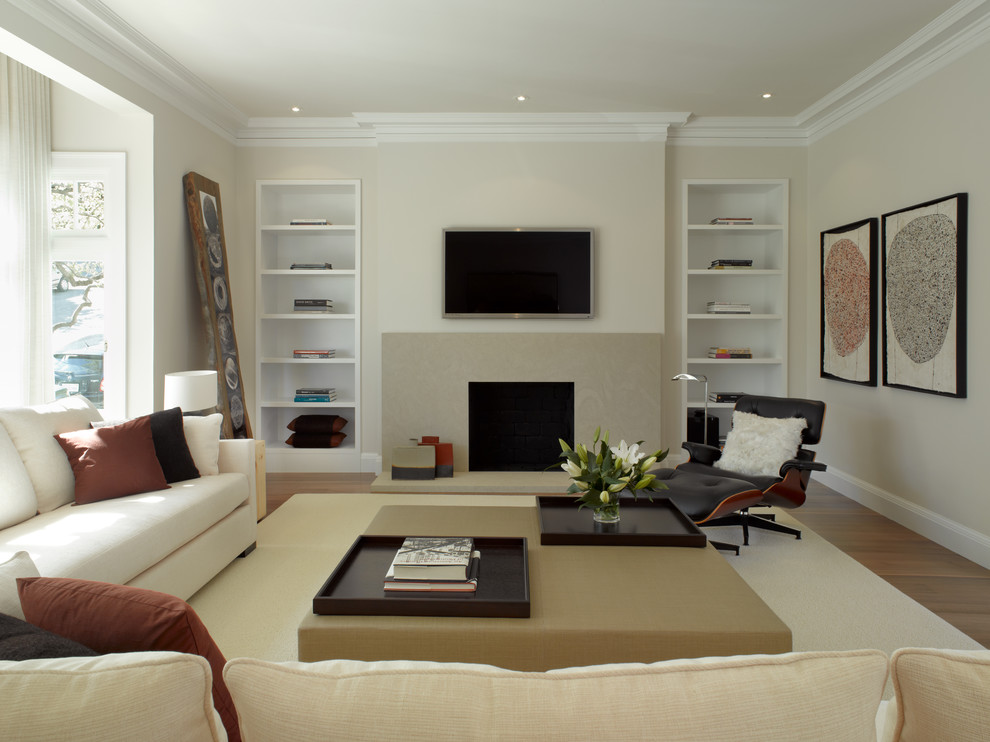 Trendy living room photo in San Francisco with a standard fireplace and a wall-mounted tv
