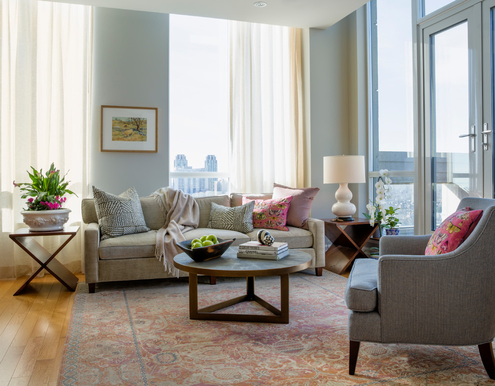 Example of a classic medium tone wood floor and brown floor living room design in Toronto with white walls
