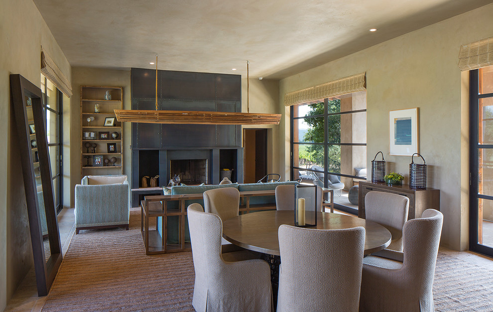 Exemple d'un grand salon nature ouvert avec un mur beige, parquet clair, une cheminée standard et un manteau de cheminée en métal.
