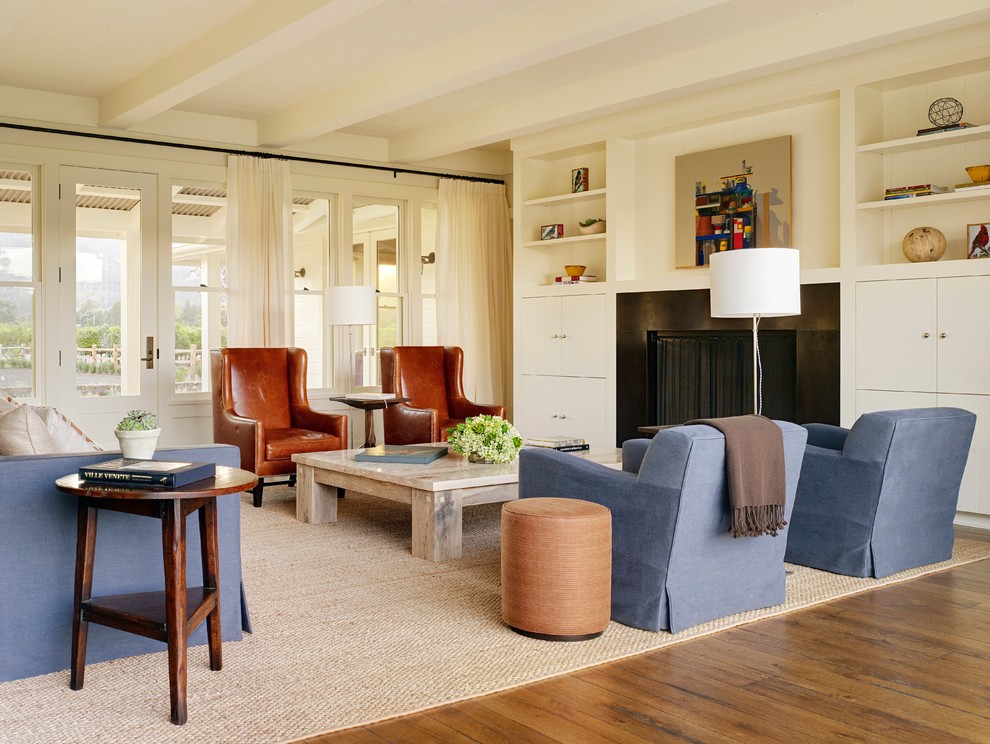 Inspiration for a farmhouse living room remodel in San Francisco with white walls and a standard fireplace