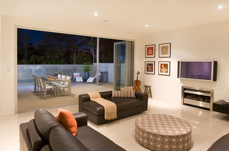 Trendy porcelain tile living room photo in Brisbane with a music area, white walls, a standard fireplace, a metal fireplace and a wall-mounted tv