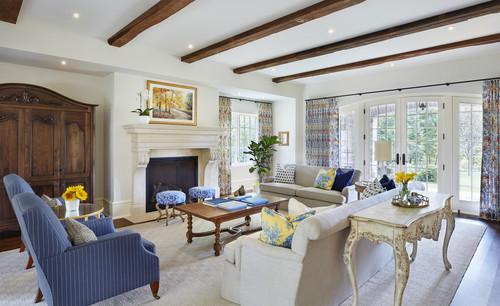 blue accent chairs in traditional french country living room