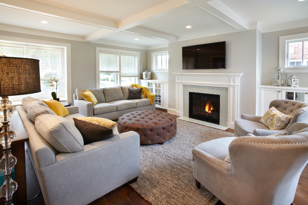 Living room - mid-sized transitional enclosed medium tone wood floor living room idea in Minneapolis with gray walls, a standard fireplace, a tile fireplace and a wall-mounted tv