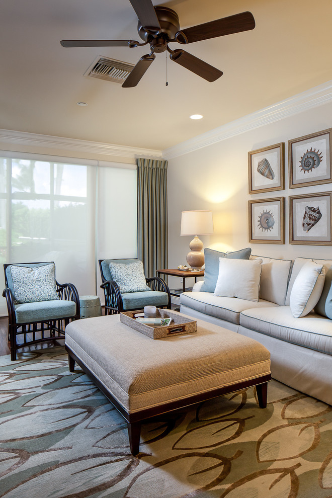 Living room - mid-sized contemporary formal and open concept dark wood floor living room idea in Miami with beige walls and no fireplace